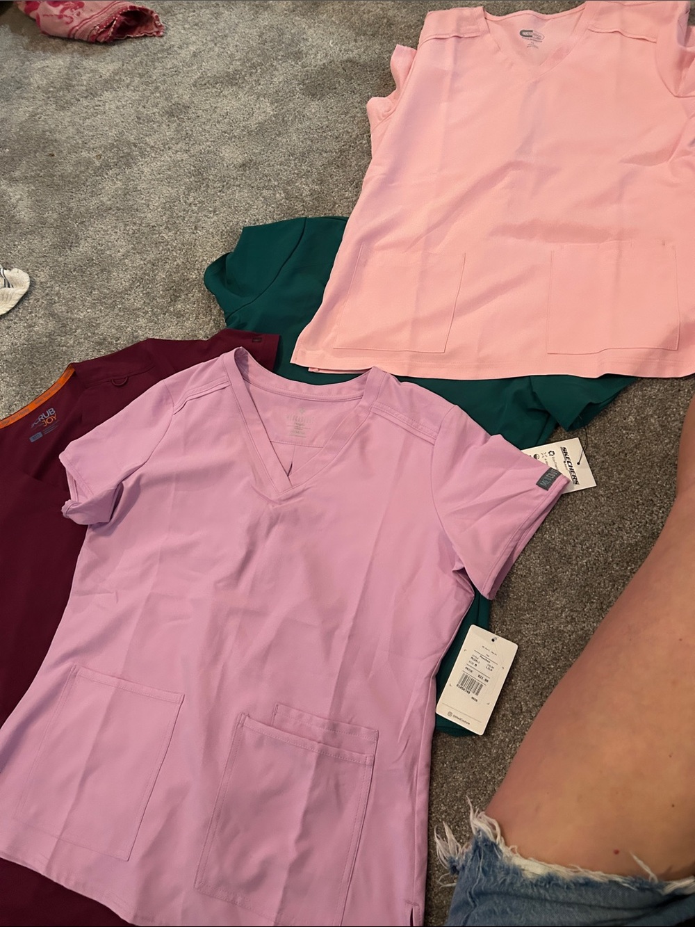 Bundle of four new with tags scrub tops